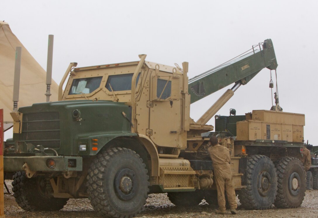 Cpl. Yosty Villafuerte, quality control inspector, Maintenance Company, Combat Logistics Regiment 15 (Forward), tests ‘Medusa,’ an AMK-36 wrecker after it was repaired following its third improvised explosive device strike, a few months ago. Medusa can now resume her mission of recovering vehicles during combat operations in support of coalition forces, thanks to the Marines of Motor Transport Maintenance Platoon.