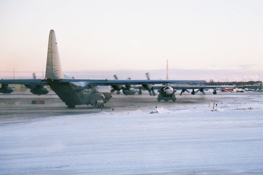 KULIS AIR NATIONAL GUARD BASE, Alaska - Aircraft from 176th Wing roll onto the runway of the Ted Stevens Anchorage International Airport, Feb. 12, 2011. Eleven aircraft from the Wing were flown from Kulis to Joint Base Elmendorf-Richardson during a ceremonial flight. The Wing is relocating from Kulis to JBER per the 2005 Defense Base Closure and Realignment proposal.  Alaska Air National Guard photo by Master Sgt. Dean Kalbfleisch.