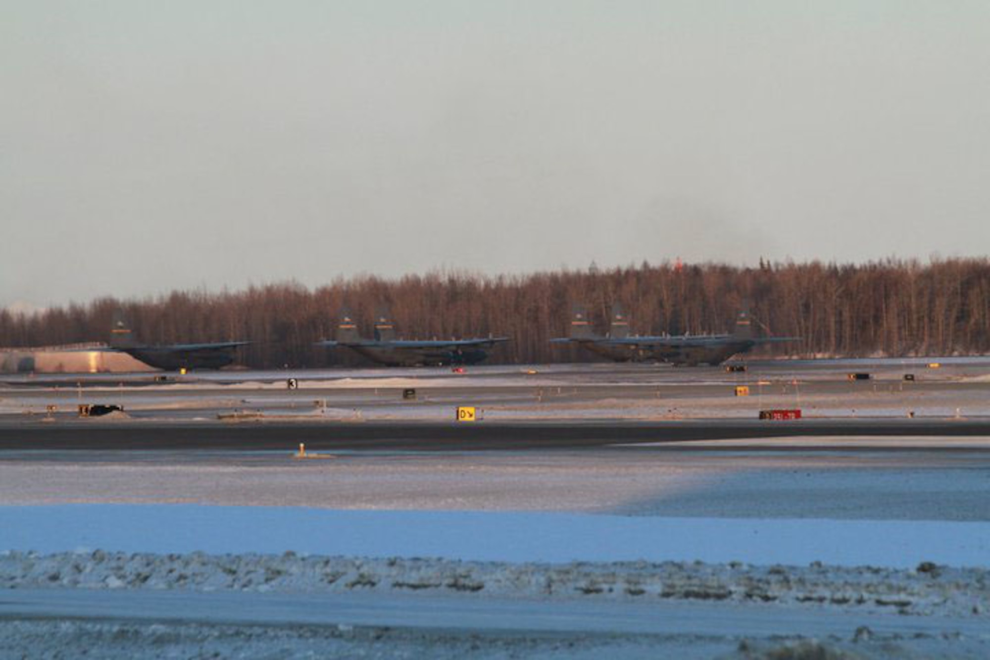 KULIS AIR NATIONAL GUARD BASE, Alaska - Aircraft from the 176th Wing are ready for take-off from the Ted Stevens Anchorage International Airport, Feb. 12, 2011. The aircraft were flown from Kulis to Joint Base Elmendorf-Richardson during a ceremonial flight. The Wing is relocating from Kulis to JBER per the 2005 Defense Base Closure and Realignment proposal.  Alaska Air National Guard photo by Tech. Sgt. Julie Arthur.