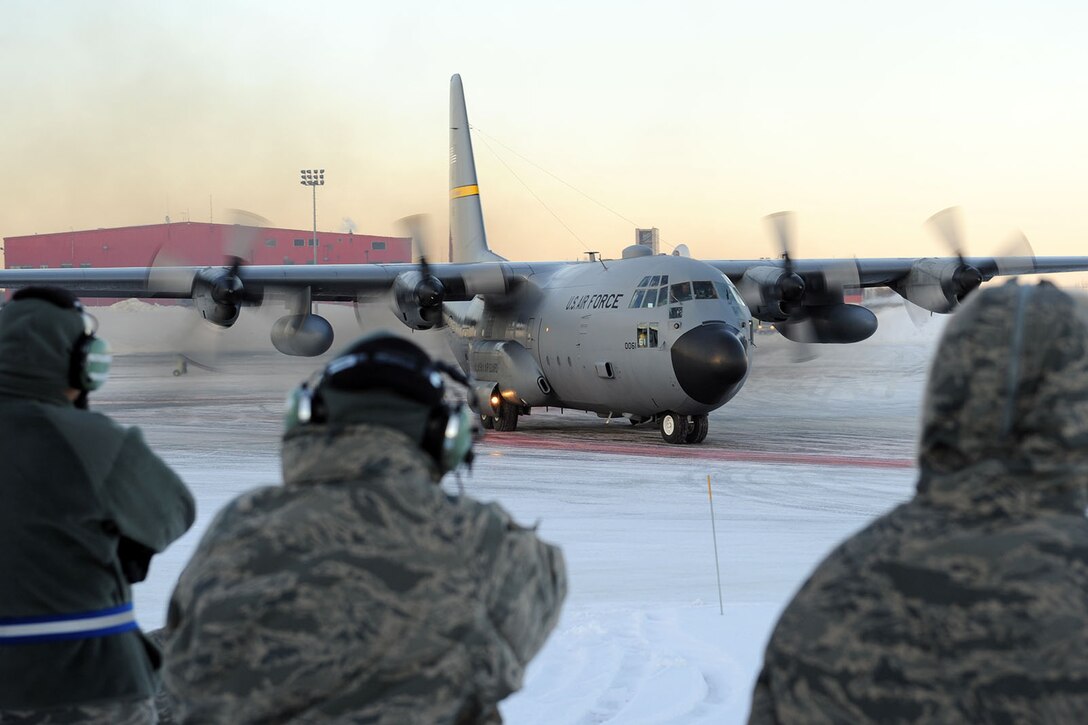 KULIS AIR NATIONAL GUARD BASE, Alaska - A C-130 from the 144th Airlift Squadron is the last aircraft to leave the ramp on the base, Feb. 12, 2011. Eleven aircraft from the 176th Wing were flown from Kulis to Joint Base Elmendorf-Richardson during a ceremonial flight. The Wing is relocating from Kulis to JBER per the 2005 Defense Base Closure and Realignment proposal.  Alaska Air National Guard photo by Master Sgt. Shannon Oleson.