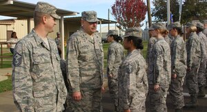 Lt. Col. Robert Landgraf, Aero Space Medical Flight commander, conducts his final open ranks at the December 2010 UTA. Landgraf's retirement brought to a close thirteen years with the 940th AMDF and a military career spanning 25 years. (U.S. Air Force photo/ Senior Master Sgt. Robert Pfenning)