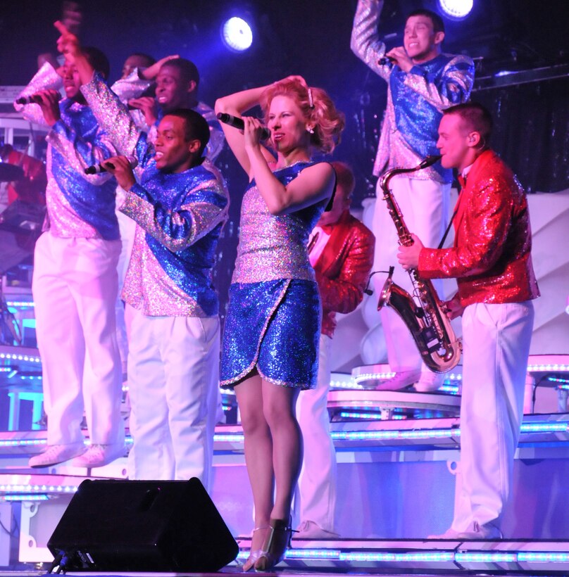 Tops In Blue rocked the house in Hangar 9 at McChord Field, here Feb. 12. Pictured center is one of the 446th Airlift Wing's own, Tech. Sgt. Katie Badowski, 446th Force Support Squadron, Services Flight craftsman. Sergeant Badowski is a vocalist who has toured with the group since June 2010.