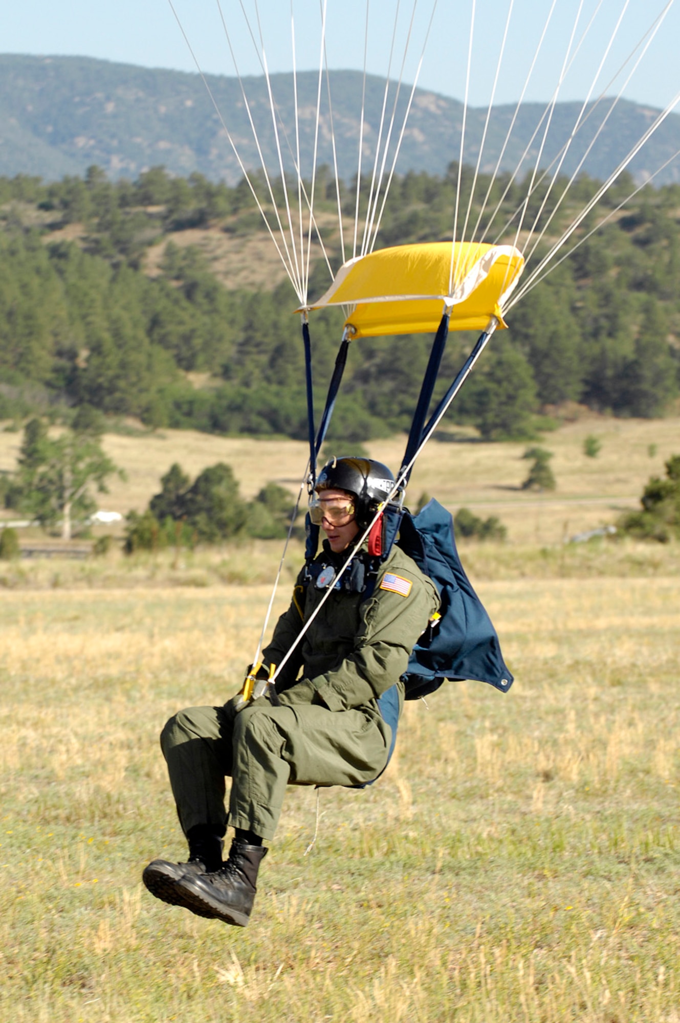U.S. Air Force Cadet 3rd Class Ryan Kim flares at precisely the right time to ensure a soft landing during the Airmanship 490, Basic Parachuting course, an airmanship program where cadets earn their basic jump wings after successfully completing five free-fall jumps, at the U.S. Air Force Academy, Colo., July 9, 2008. (U.S. Air Force photo by Mike Kaplan/Released)