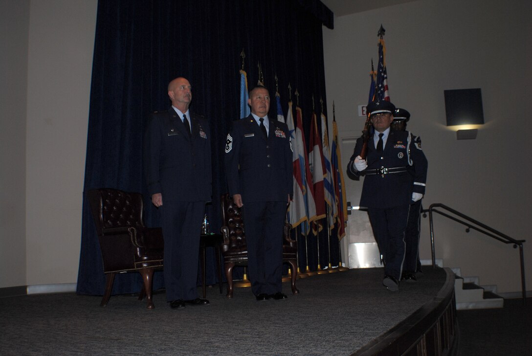 Maj. Jay Johnson, 433rd Aircraft Maintenance Squadron commander and First Sergeant, Chief Master Sgt. Juan Villareal, stand at attention as members of the 433rd Airlift Wing’s Honor Guard, present the colors during Villareal’s retirement ceremony, Feb. 12 at the Inter-American Air Forces Academy Auditorium at Lackland Air Force Base, Texas. During his 33 years of military service in the Air Force, Villareal from Laredo, Texas has received numerous military medals and awards. Villareal enlisted in the Air Force in 1978 and retired from active duty in 1992 as a master sergeant. After a six-month break in service, Villareal joined the Air Force Reserve and remained a member of the Alamo Wing until February of this year. (U.S. Air Force photo/Senior Airman Luis Loza Gutierrez)

