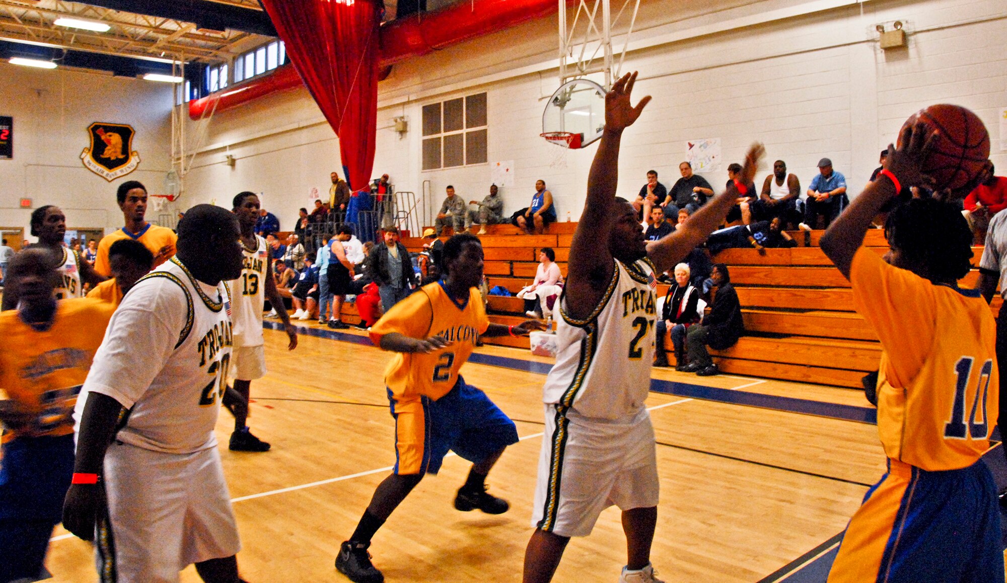 A Falcons player looks for a teammate to pass the ball to at the Northwest Florida Special Olympics basketball championship Feb. 4 at Eglin Fitness Center. The Trojans beat the Falcons 16-8. (U.S. Air Force Photo/Sachel Seabrook)