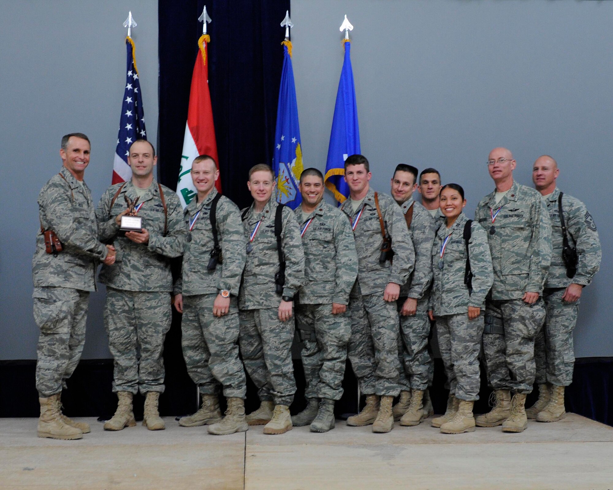 The 2010 321st Air Expeditionary Wing Team of the Year is the A3 Operations Division, 321 AEW Headquarters Staff.  The A3 staff members are the primary advisors for the $3.3 billion F-16 program; the largest United States and Government of Iraq Building Partnership Capacity project.  This team is the project lead for the $31 million Sector Operations Center; the Command and Control cornerstone of Iraq’s Air Defense.  They revamped the Air Traffic Control training program by mobilizing fourteen contractors and opened additional training locations resulting in a sixty percent increase in ATC capabilities. (U.S. Air Force Photo by Staff Sgt. Levi Riendeau)