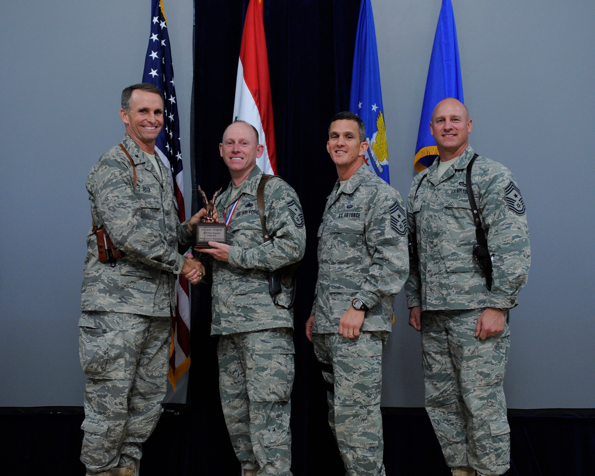 The 2010 First Sergeant of the Year is Senior Master Sgt. Jerry Thornton, 321st Air Expeditionary Wing. Sergeant Thornton (second from left) skillfully crafted the Wing’s first-ever physical training program, ensuring the wing met all aspects of Air Forces Central’s directives all the while maintaining a 92 percent pass rate.  He revamped the Wing’s Right Start Program, slashing non-mission critical information and returning newly assigned Airmen to duty in half the time.  (U.S. Air Force Photo by Staff Sgt. Levi Riendeau)