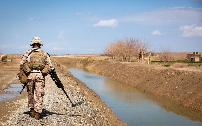 Lance Cpl. Arturo Valtierra, a mortarman with Redemption II, Weapons Company, 2nd Battalion, 1st Marine Regiment, scans for IEDs during a foot patrol to a local Afghan National Police near Patrol Base Gorgak, Garmsir District, Helmand province, Afghanistan, Feb. 13.