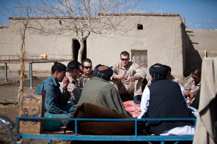 Marines with Weapons Company, 2nd Battalion, 1st Marine Regiment meet with the heads of a local Afghan National Police station, Feb. 13, to discuss security and civil affairs projects in Laki, Garmsir District, Helmand province, Afghanistan. Weapons Company's headquarters is Patrol Base Gorgak in Garmsir District.