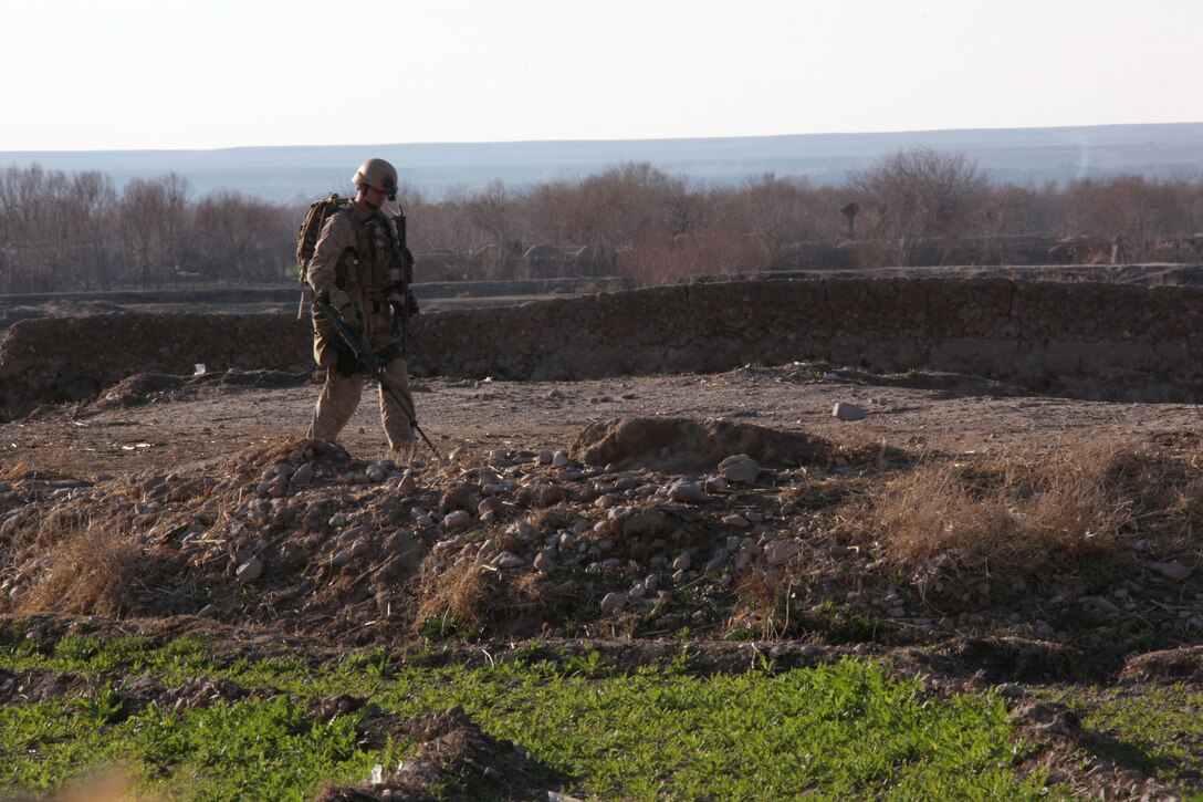 U.S. Marine Corps Gunnery Sgt. Brad Rickabaugh, Explosive Ordnance Disposal team leader attached to Company I, Battalion Landing Team 3/8, 26th Marine Expeditionary Unit, Regimental Combat Team 8, prepares to clear an improvised explosive device discovered by Pablo, a military working dog, at Kakar, Helmand province, Afghanistan, Feb. 14, 2011. Rickabaugh, Pablo and Explosive Ordnance Disposal Marines found and cleared seven main charges, three pressure-plates and a command-pull device from Kakar that day. Elements of 26th Marine Expeditionary Unit deployed to Afghanistan to provide regional security in Helmand province in support of the International Security Assistance Force.