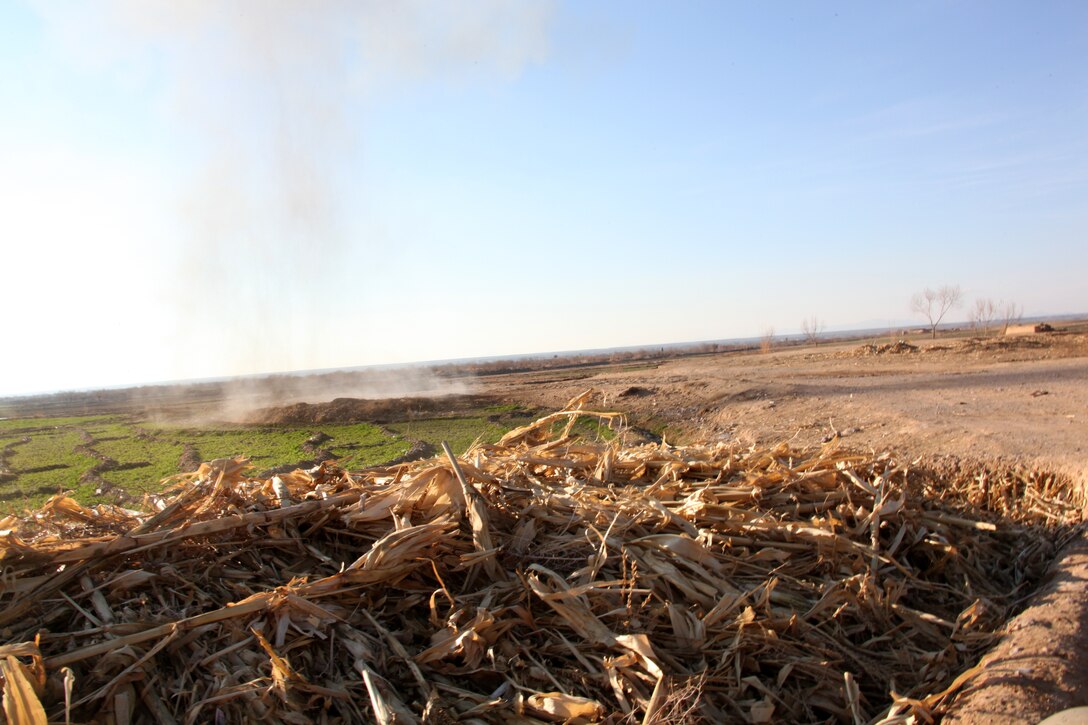 Explosive Ordnance Disposal Marines attached to Company I, Battalion Landing Team 3/8, 26th Marine Expeditionary Unit, Regimental Combat Team 8, conduct a controlled detonation to clear an improvised explosive device, at Kakar, Helmand province, Afghanistan, Feb. 14, 2011. Explosive Ordnance Disposal Marines found and cleared seven main charges, three pressure-plates and a command-pull device from Kakar that day. Elements of 26th Marine Expeditionary Unit deployed to Afghanistan to provide regional security in Helmand province in support of the International Security Assistance Force.