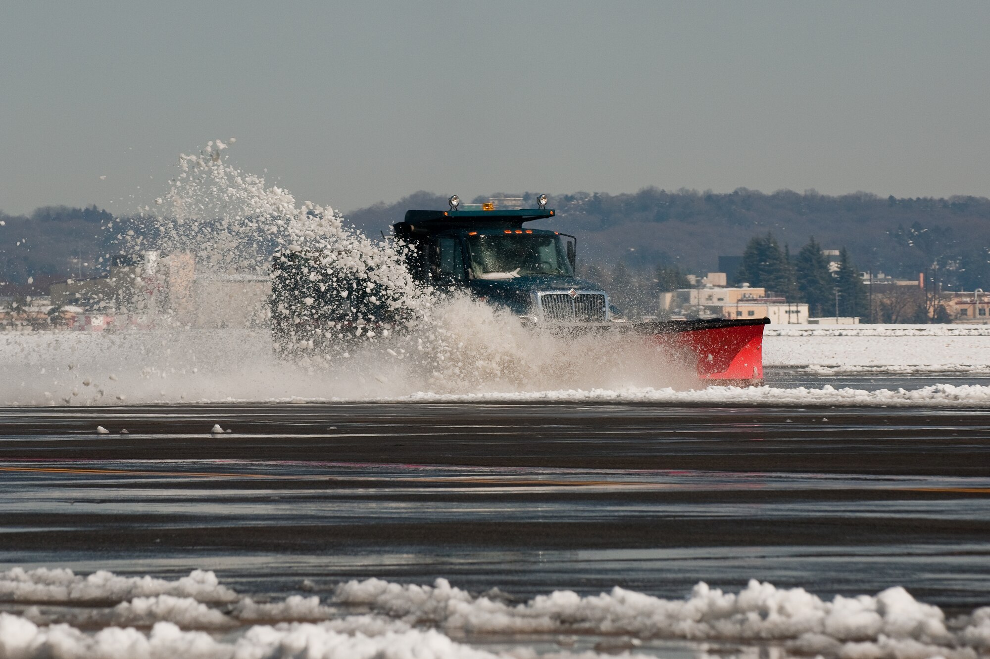YOKOTA AIR BASE, Japan -- Fifteen members of the 374th Civil Engineer Squadron Horizontal Shop "Dirt Boyz" began snow removal just after 6 p.m. Feb. 14 and continued throughout the morning of Feb. 15.  Five inches of snow fell on base in just over seven hours.  The accumulation paled in comparison to the record 15 inches of snow that fell at Yokota Feb. 15-16, 1968, breaking a mark that had stood since 1951. The record snowfall for Tokyo is 18.3 inches in 1883, according to historical records.  (U.S. Air Force photo/Osakabe Yasuo)