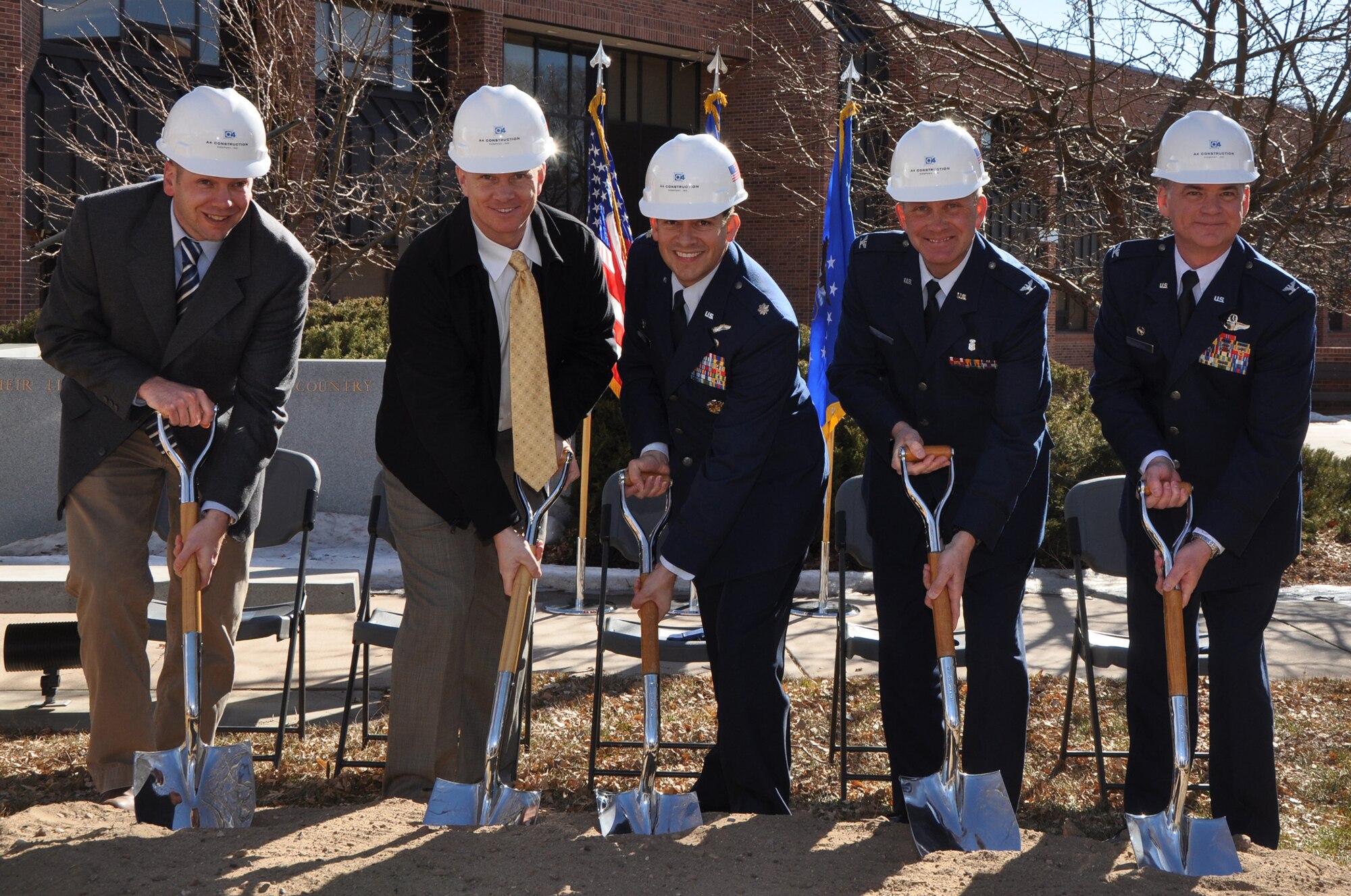 From left to right, Mr. John Galloway, Resident Engineer, Army Corps of Engineers, Mr. Shawn Anderson, Vice President, A4 Construction, Lt. Col. Carlos Ortiz, commander, 52 Airlift Squadron, Col. Richard Batzer, Director of the Area Laboratory, 21st Dental Squadron, and Col. Jack H. Pittman, Jr., commander, 302nd Airlift Wing, break ground for a new facility at Peterson Air Force Base, Colo., February 14. The building will house Total Force Integration operations. (U.S. Air Force photo/Tech. Sgt. Daniel Butterfield)