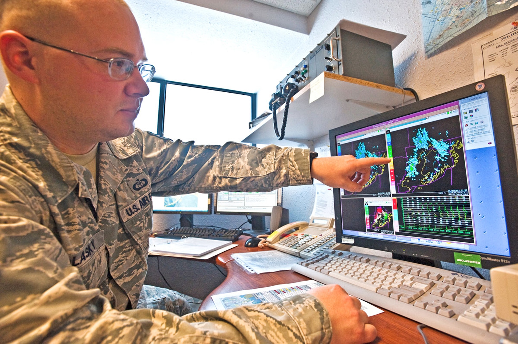 Staff Sgt. Raymond Polasky points out changes in weather patterns on radar, Feb. 9, 2011, at Joint Base Elmendorf-Richardson, Alaska. The weather flight uses tools like weather sensors, satellites and radar to accurately forecast for eight different airframes. Sergeant Polasky is assigned to the 3rd Operational Support Squadron. (U.S. Air Force photo/Airman 1st Class Jack Sanders)