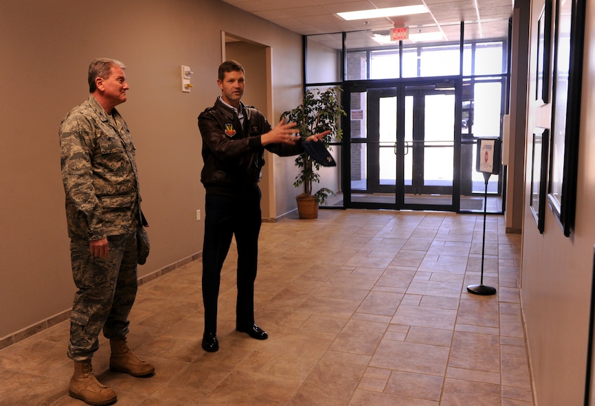 MOODY AIR FORCE BASE, Ga.-- Col. Mark Moore, 9th Air Force vice commander, observes as Col. Gary Henderson, 23rd Wing commander, gives a brief history lesson about the Flying Tigers during his visit Feb. 14. Colonel Moore was able to see Heritage Park, which highlights most the aircrafts flown by Flying Tigers throughout history. (U.S. Air Force photo/Airman 1st Class Benjamin Wiseman)(RELEASED)
