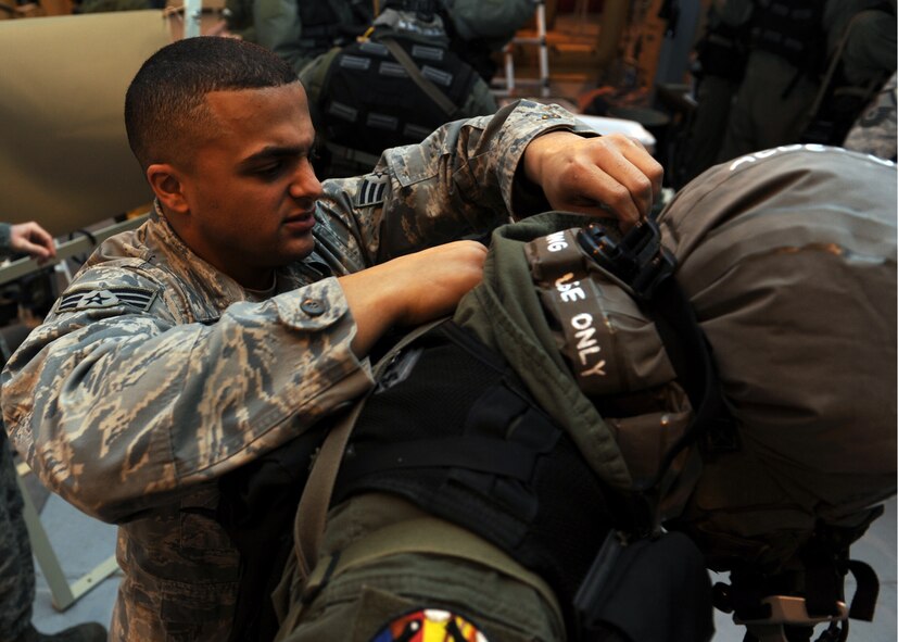 MINOT AIR FORCE BASE, N.D. -- Senior Airman Jordan Allen, 5th Operation Support Squadron aircrew flight equipment journeyman, ensures aircrew members have a proper seal prior to the beginning of a decontamination exercise here Feb. 10. Buddy checks on equipment are an important part of the process to keep Air Force Global Strike Command Airmen’s combat readiness skills sharp. (U.S. Air Force photo/Senior Airman Michael J. Veloz)