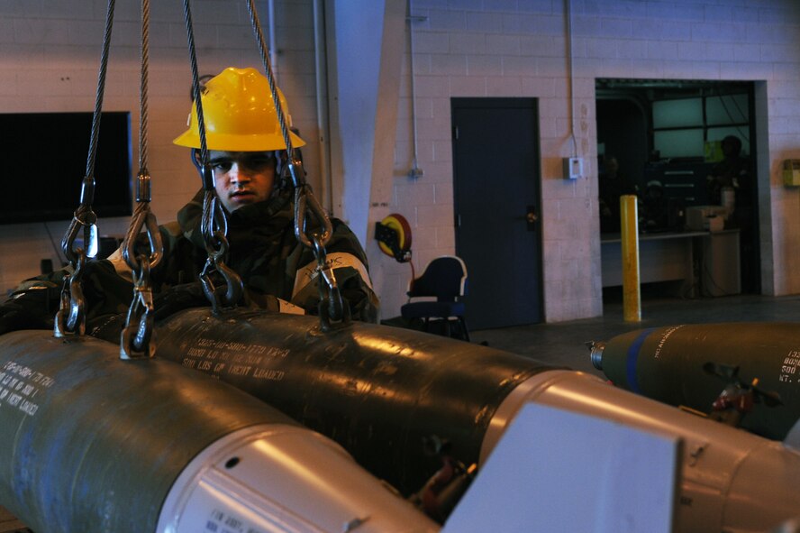 MINOT AIR FORCE BASE, N.D. -- Senior Airman Joshua Wynne, 5th Munitions Squadron maintenance crew member, helps assemble six unguided bombs at the conventional maintenance shop during a base exercise here Feb. 11. Conventional maintenance crew members are evaluated while loading and assembling bombs to meet armor load standardizations to support the 23rd and 69th Bomb Squadrons. (U.S. Air Force photo/Airman 1st Class Aaron-Forrest Wainwright)