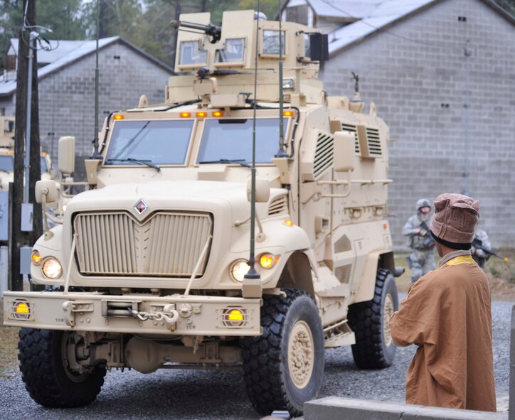 MOODY AIR FORCE BASE, Ga. -- A convoy of mine-resistant-ambush-protected vehicles move through the military operations in urban terrain training village to simulate dropping of supplies to a hospital Feb. 10. This was part of the MOUT village demonstration given to Brig. Gen. Jimmy McMillian, director of security forces, Headquarters U.S. Air Force, during his visit to Moody. (U.S. Air Force photo/Airman 1st Class Nicholas Benroth)(RELEASED)