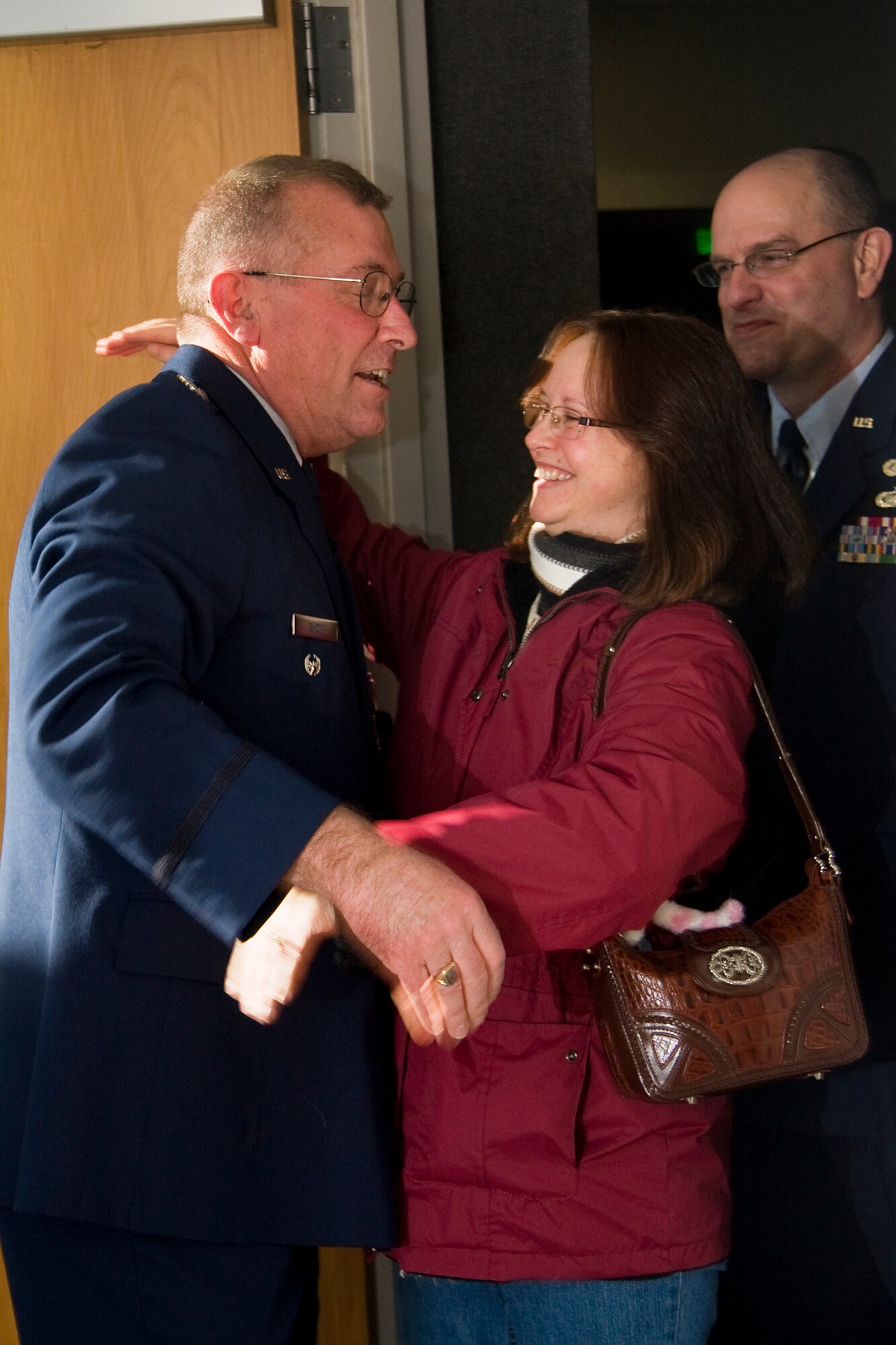 GRISSOM AIR RESERVE BASE, Ind. -- Pam Yeager and Master Sgt. Kevin Yeager congratulate Lt. Col. Phil Shott, 434th Mission Support Group deputy commander, shortly after his retirement ceremony here. Mrs. Yeager is the 434th Air Refueling Wing commander?s secretary, and Sergeant Yeager is a personnel systems manager for the 434th Force Support Squadron. (U.S. Air Force photo/Tech. Sgt. Mark R. W. Orders-Woempner)
