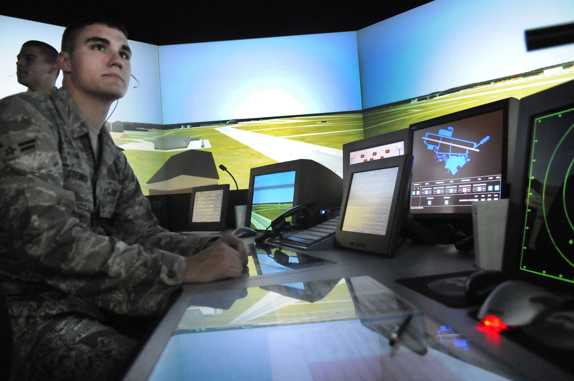 A1C Jeff Steuber trains on the Tower Simulation System.  The TSS, installed at Robins in Oct 2003,  provides the training team with the tools to teach and evaluate the knowledge and skills of an apprentice prior to having them work in a live environment.  U. S. Air Force photo by Sue Sapp