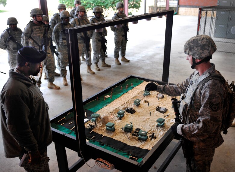 MOODY AIR FORCE BASE, Ga. -- Staff Sgt. David Newman, 23rd Security Forces response force leader, briefs Brig. Gen. Jimmy McMillian, security forces director at Headquarters U.S. Air Force, on the security plans during an operational readiness exercise Feb. 10. There were four briefers that showed the general the plans of what they would be doing during the ORE. (U.S. Air Force photo/Airman 1st Class Nicholas Benroth)(RELEASED)
