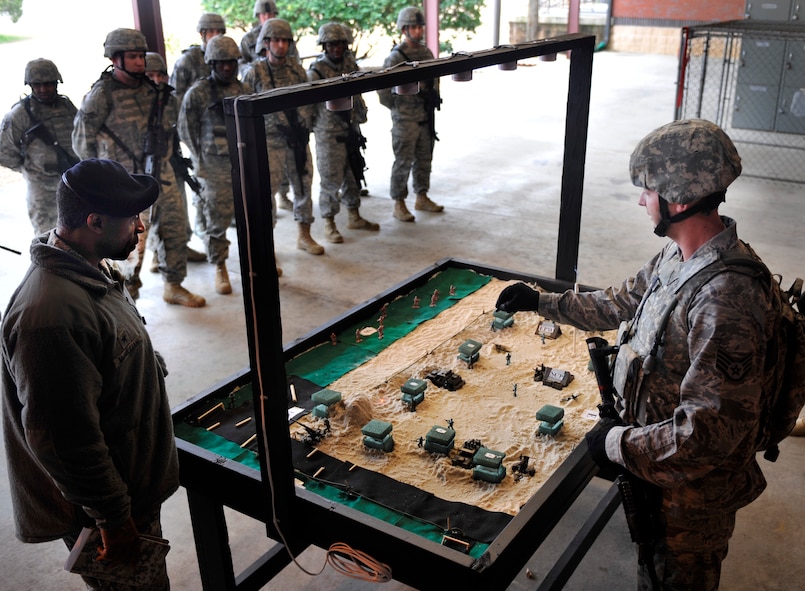 MOODY AIR FORCE BASE, Ga. -- Staff Sgt. David Newman, 23rd Security Forces response force leader, briefs Brig. Gen. Jimmy McMillian, security forces director at Headquarters U.S. Air Force, on the security plans during an operational readiness exercise Feb. 10. There were four briefers that showed the general the plans of what they would be doing during the ORE. (U.S. Air Force photo/Airman 1st Class Nicholas Benroth)(RELEASED)
