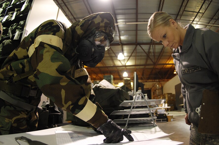 MINOT AIR FORCE BASE, N.D. – Senior Airman Gregory Rivera, 5th Logistics Readiness Squadron logistic supply apprentice, explains the inventory of contents in the chem. bag to an inspector during a base exercise here Feb. 8. (U.S. Air Force photo/Staff Sgt. Miguel Lara III) 