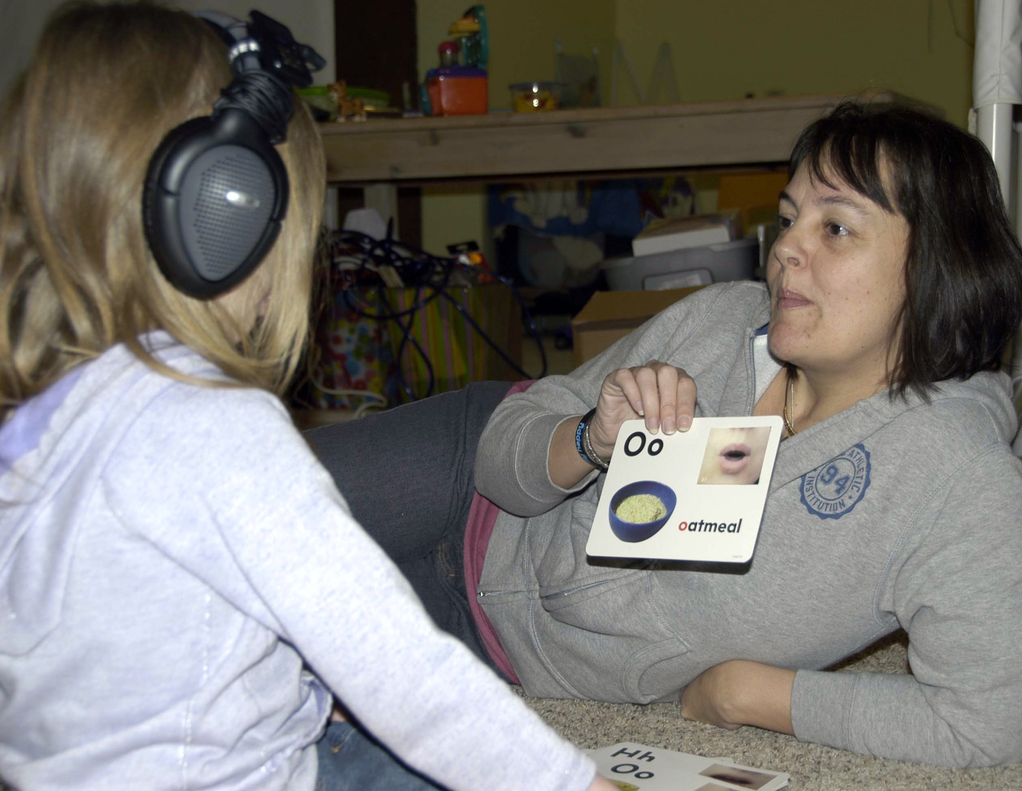 Helen Ezell, founder and director of the Autism Education Center in Lynn Haven, Fla., shows a speech therapy card to 5-year-old Erika Mickle during a therapy session at the center. Because of her efforts with the AEC and within the community, Mrs. Ezell was named Lynn Haven’s Citizen of the Year. (U.S. Air Force photo/Angela Pope)