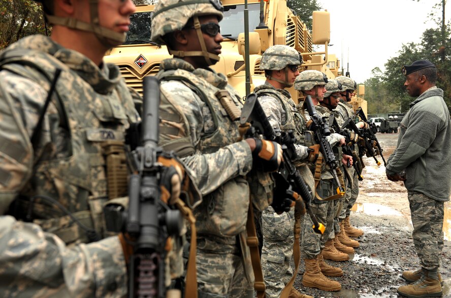 MOODY AIR FORCE BASE, Ga.-- Brig. Gen. Jimmy McMillian, Headquarters Air Force director of security forces, ask questions about  Airmen from the 822nd Base Defense Squadron during a base visit Feb. 10. General McMillan and the squadron members made small talk before the Airmen demonstrated a portion of the training they receive on a daily basis. (U.S. Air Force photo/Airman 1st Class Joshua Green)(RELEASED)
