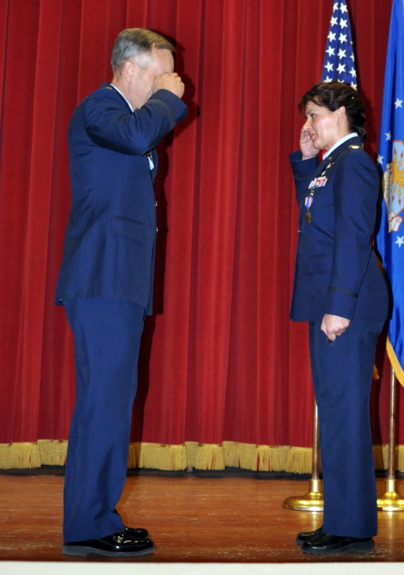 Lt. Col. Monsita J. Faley salutes Maj. Gen. Eric W. Crabtree, commander, Fourth Air Force, March Air Reserve Base, Calif., after she was presented with a coin on behalf of Lt. Col. Carolyn Newhouse, commander, 45th Aeromedical Evacuation Squadron, Macdill Air Force Base, Fla.  Colonel Monsita was recognized for her assistance as an excercise evaluation team member during the unit's 2010 operational readiness evaluation.