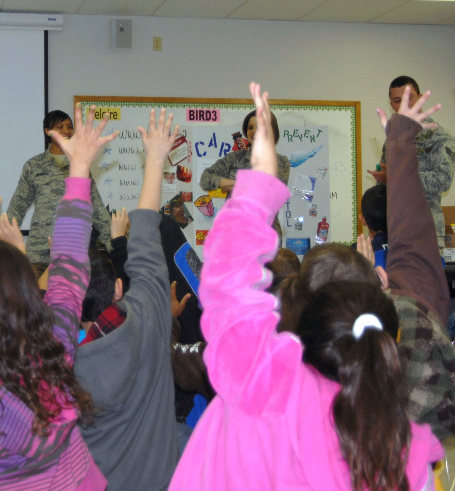GOODFELLOW AIR FORCE BASE, Texas-- Members of the 17th Medical Operations Squadron give a presentation to more than 100 children at Belaire  Elementary, Feb. 7. The group is scheduled to visit Reagan Elementary later this month in recognition of Children's Dental Health Month. (U.S. Air Force photo/Airman 1st Class Jessica D. Keith)