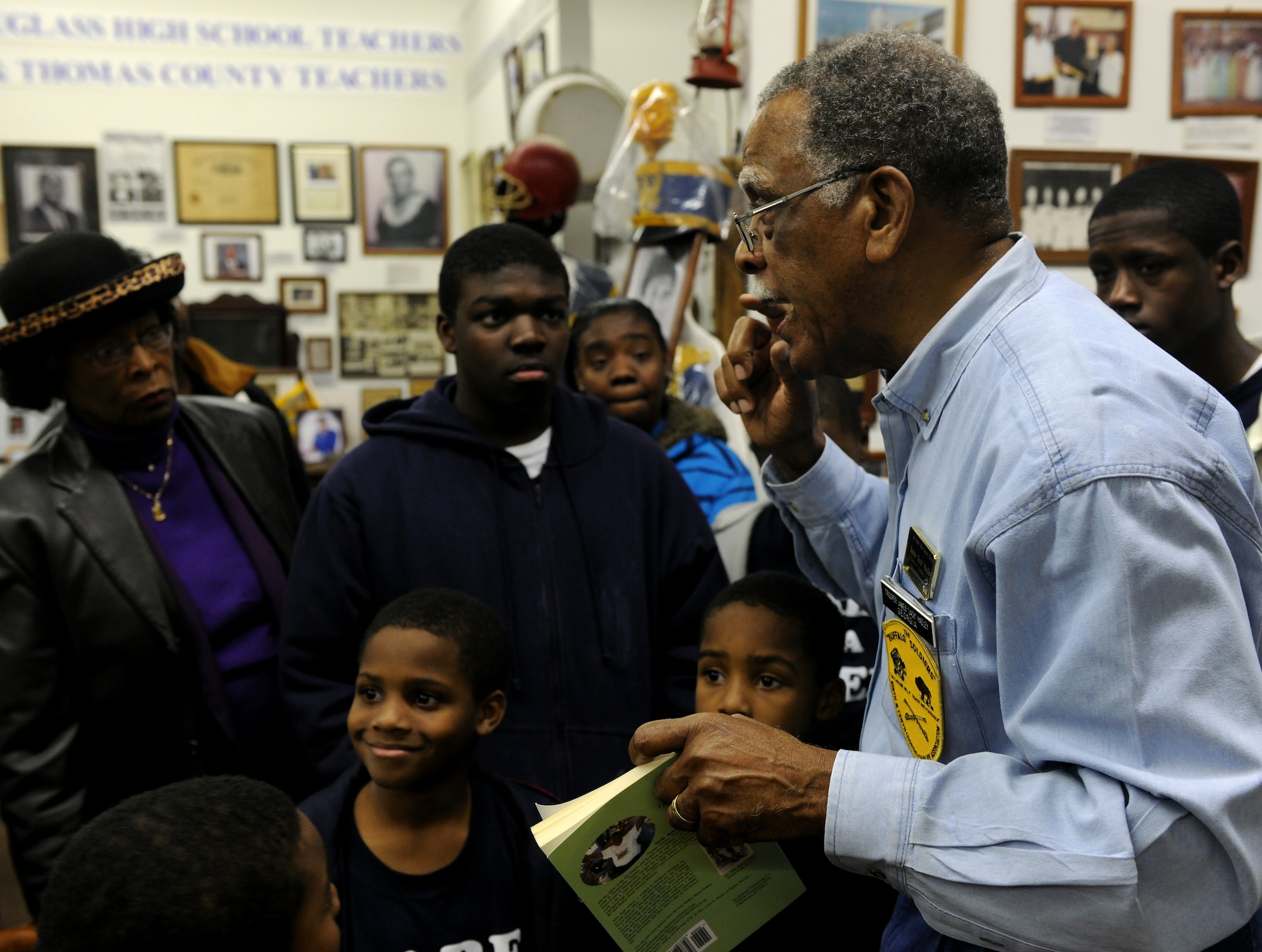 THOMASVILLE, Ga.-- Retired Chief Master Sgt. James “Jack” Hadley gives a brief history lesson to children from the local community during a tour of the Jack Hadley Black History Museum Feb. 12. After retiring from the Air Force, Chief Hadley moved back to his hometown to educate people about African-American history. (U.S. Air Force photo/Airman 1st Class Benjamin Wiseman)(RELEASED)