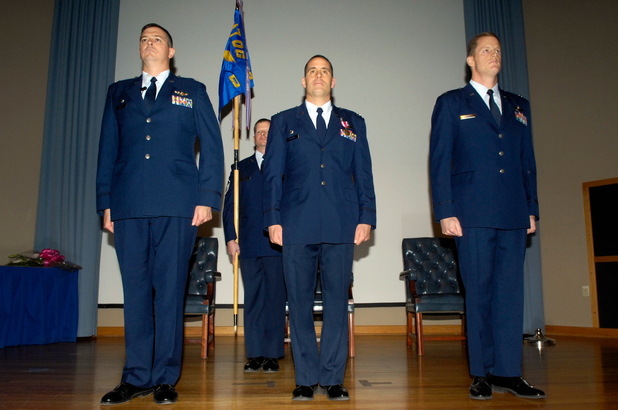 LAUGHLIN AIR FORCE BASE, Texas -- Colonel Craig Wills, 47th Operations Group commander, Lt. Col. Michael Brockey, the new 47th OG deputy commander, and Lt. Col. John Binder, the new 47th Operations Support Squadron commander, listen to the presentation of the orders at the 47th OSS change of command Feb. 11. Lieutenant Col. Binder assumed command of the 47th OSS from Lt. Col. Michael Brockey. (U.S. Air Force photo by Jose Mendoza)