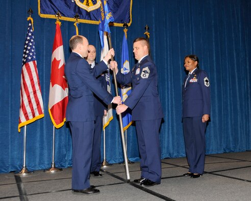 McGHEE TYSON AIR NATIONAL GUARD BASE, Tenn. - Chief Master Sgt. Donald E. Felch, center, accepts leadership of the Paul H. Lankford Enlisted Professional Military Education Center from Col. Bradley N. McRee, left, commander of The I.G. Brown Air National Guard Training and Education Center, in a ceremony held at Wilson Hall here, Feb. 10, 2011, while former commandant Chief Master Sgt. Deborah F. Davidson, right, looks on.  (U.S. Air Force photo by Master Sgt. Kurt Skoglund/Released) 