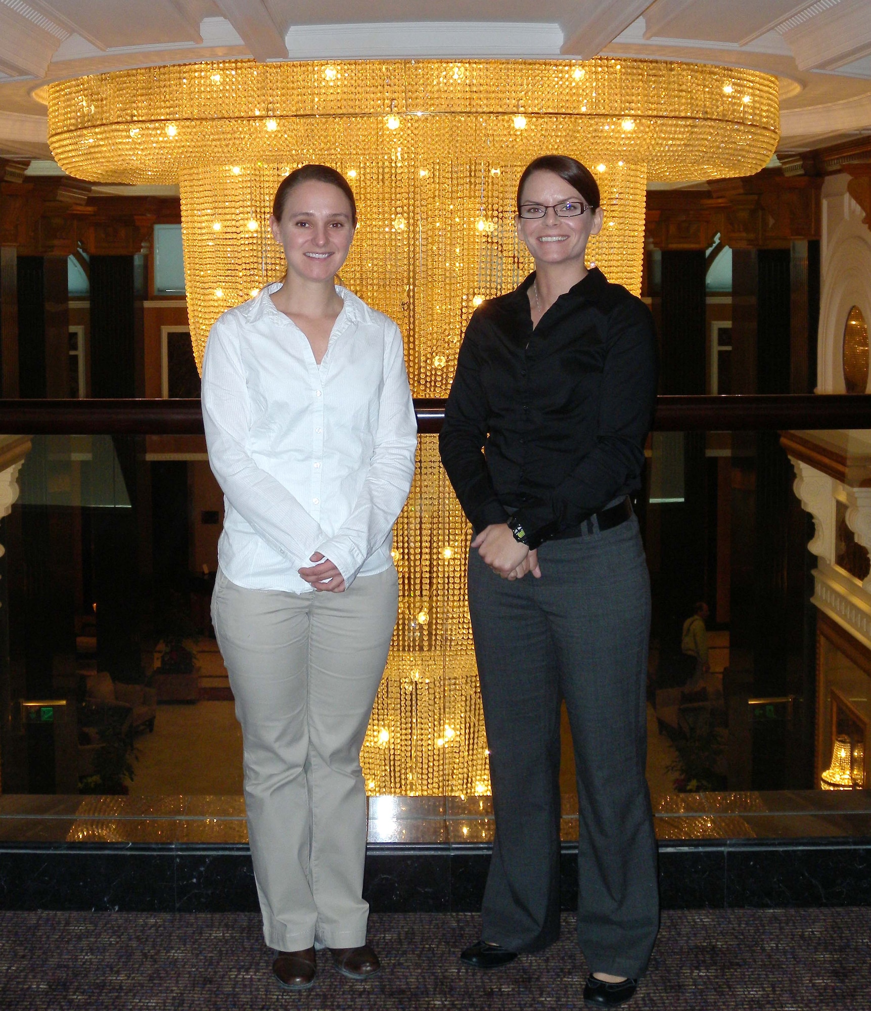 International Contract Corruption Task Force Special Agents Megan Rauch and Sue Lantrip stop for a photo January 30 after a conference held in Bahrain. Ms. Rauch and Ms. Lantrip were among seven members that attended the conference which informed government and civilian contractors about their job.  (U.S. Air Force photo/ Staff Sgt. Anthony Graham)