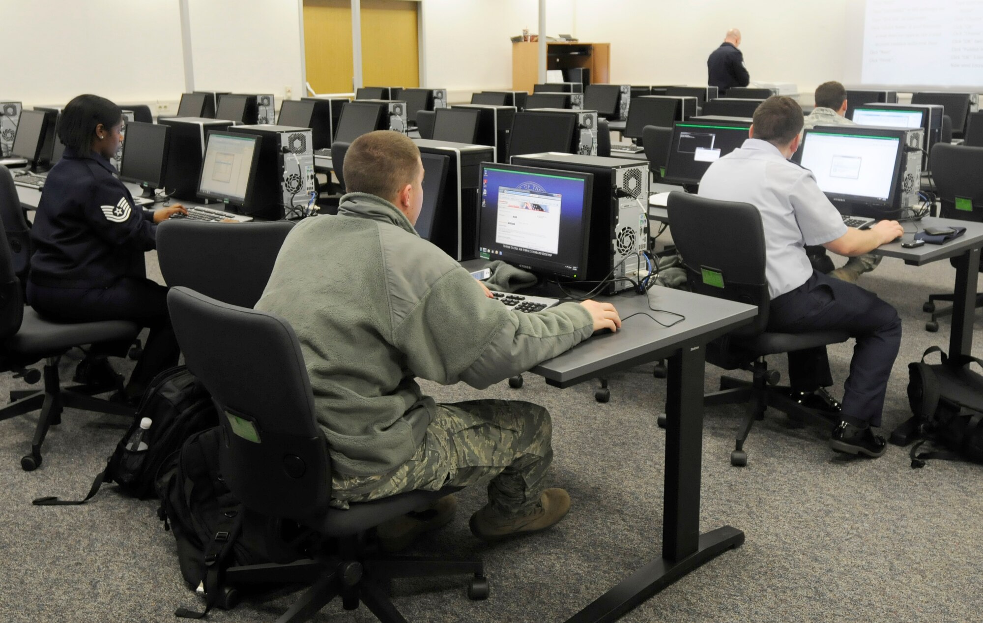 U.S. Air Force Airmen set up e-mail accounts at the new Ramstein Inprocessing building on Ramstein Air Base, Germany, Feb. 14, 2011. The 86th Airlift Wing recently kicked off a two-day inprocessing program to help ease the transition process for all new Airmen arriving to the Kaiserslautern Military Community.  (U.S. Air Force photo by Airman Kendra Alba)