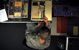 Senior Airman Amos Hommel performs a meter calibrations on a GRT-22 radio amplifier during a periodic maintenance inspection at the transmissions systems office Feb. 11, 2011 on Joint Base Charleston, S.C. The PMI is performed at designated dates throughout the year to ensure the equipment is functioning properly over an extended period of time. Airman Hommel is a Radio Frequency Transmissions Systems Technician with the 628th Communications Squadron. (U.S. Air Force photo/Senior Airman Timothy Taylor)