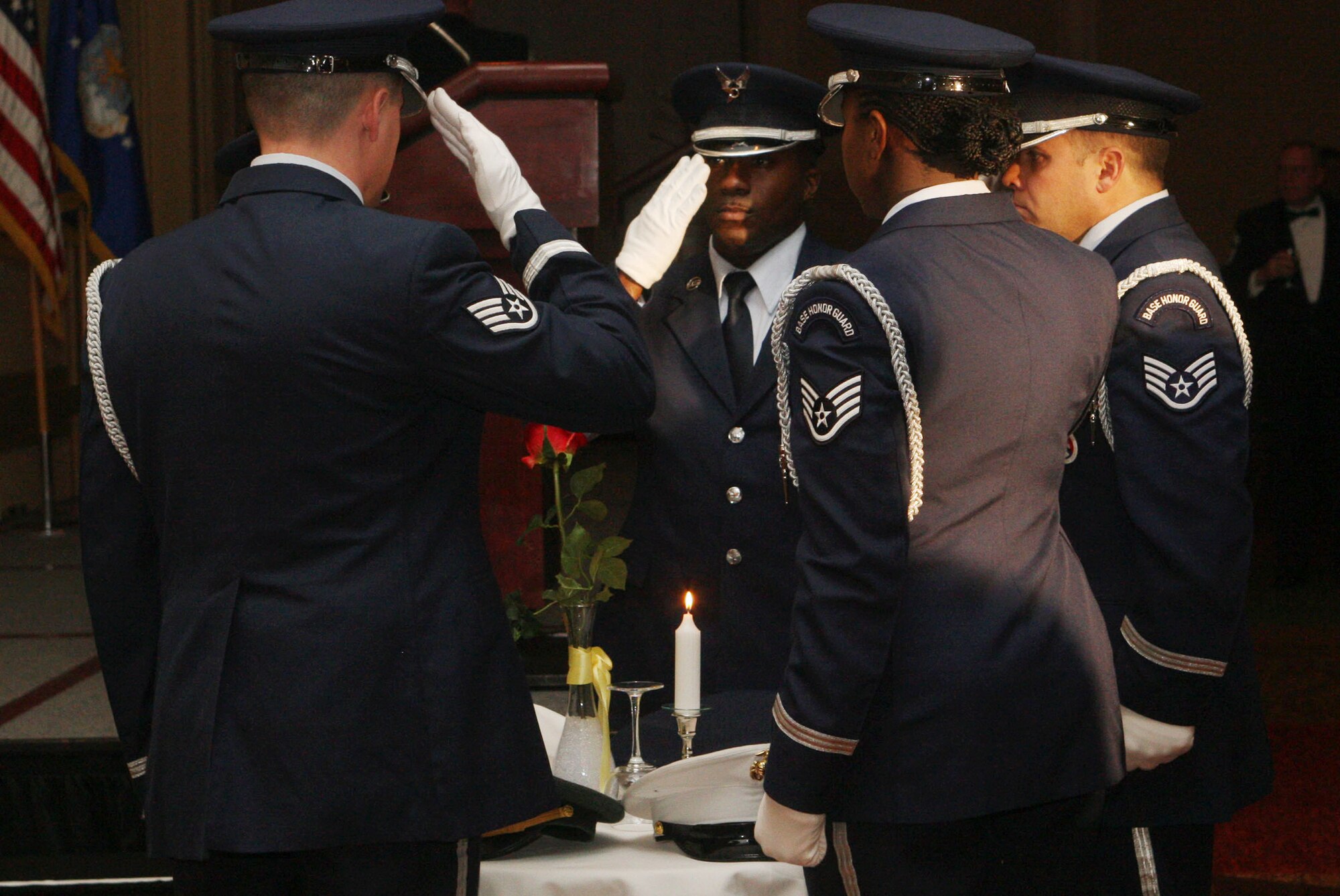 Members of the 94th Airlift Wing Honor Guard performs the POW/MIA ceremony as Chief Master Sgt. Les Davy from the 22nd Air Force narrates Feb 5. (U.S. Air Force Photo/Don Peek)