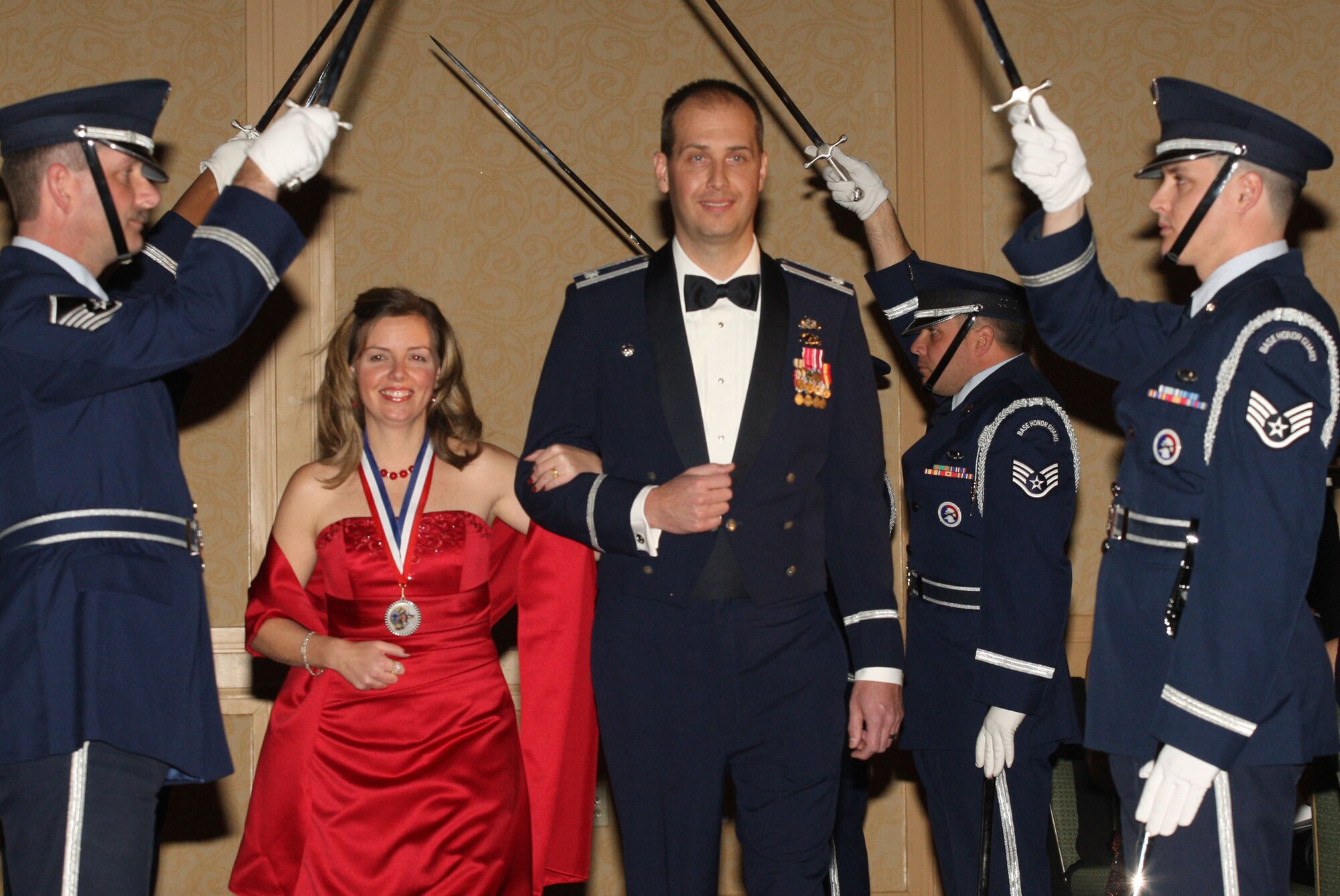 - Honorary Chief Heather Whitehead and her husband, Lt. Col. Chip Whitehead, Commander of the 94th Civil Engineer Squadron make their way through a Saber Team formation from members of the 94th Airlift Wing Honor Guard, marking the opening of the evenings event Feb 5. Heather was recognized for her numerous contributions to the Dobbins reserve community. (U.S. Air Force Photo/Don Peek)