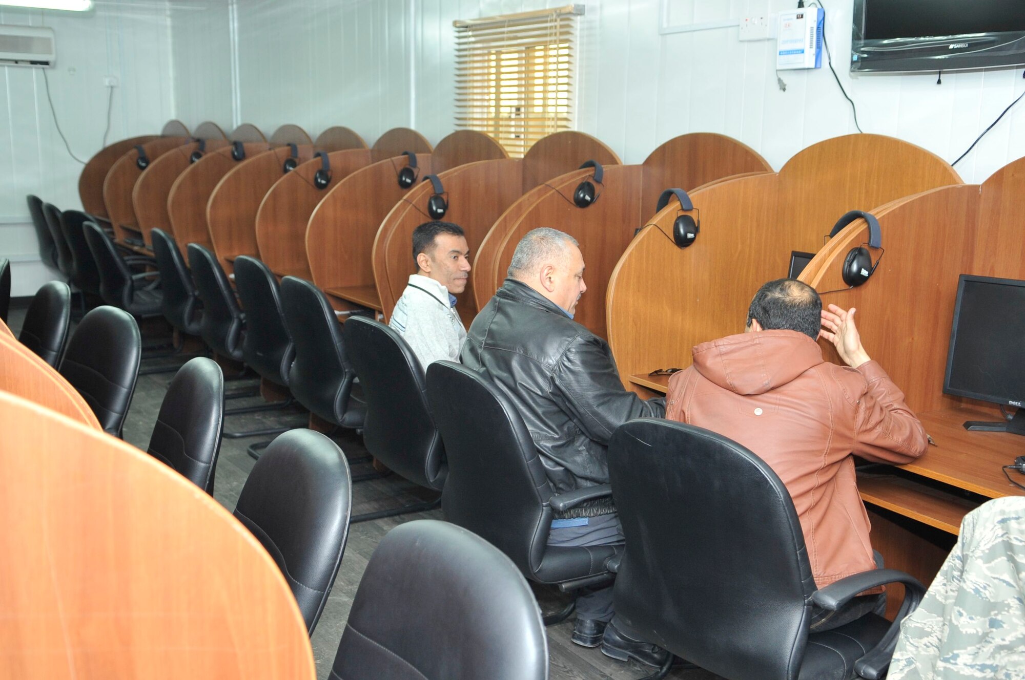 BAGHDAD, Iraq – Iraqis sit at work stations waiting to take a proficiency test in the English language at Forward Operating Base Union III, International Zone, here Feb. 6. (U.S. Air Force photo by Senior Master Sgt. Larry Schneck/Released)