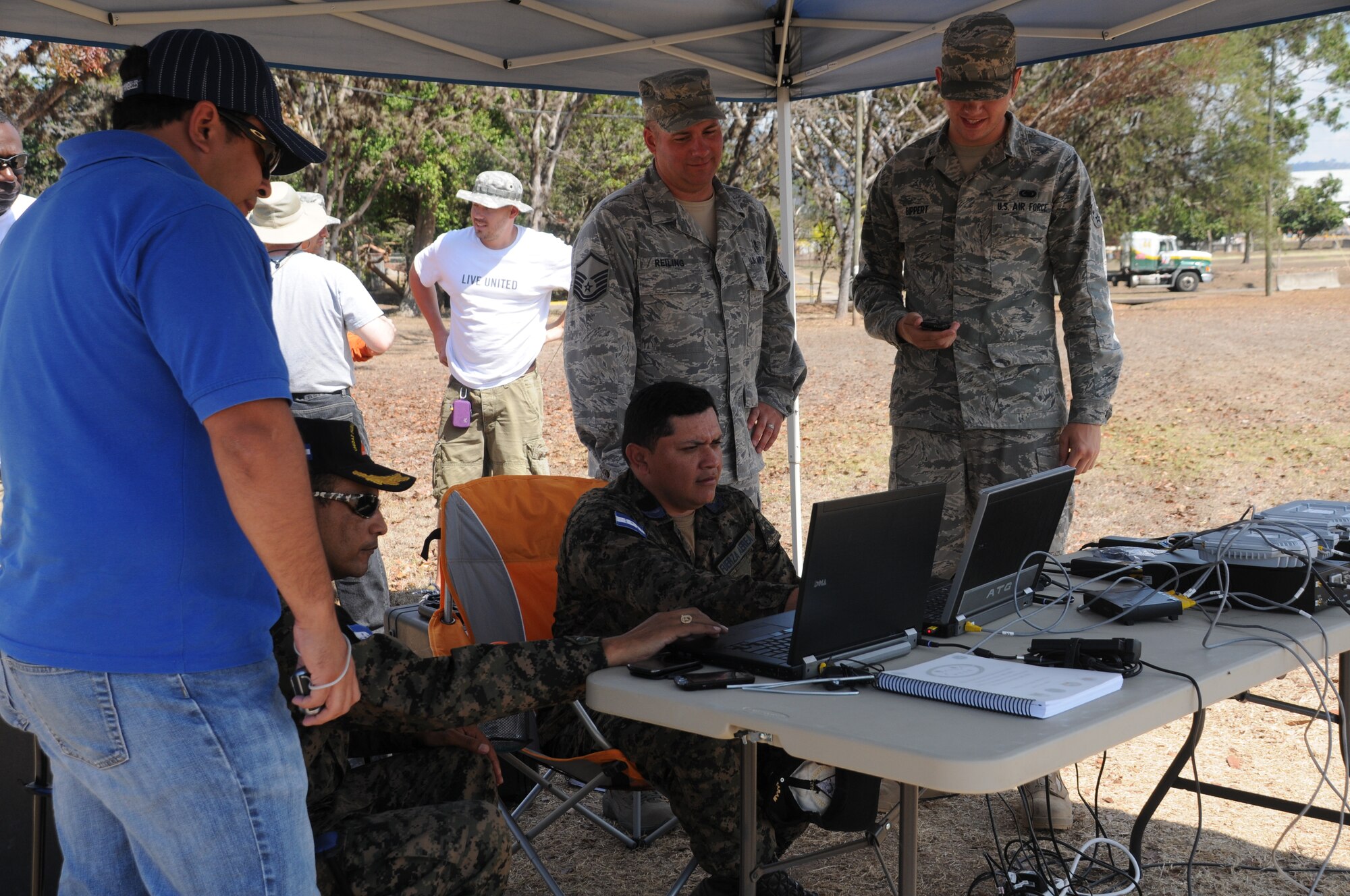 SOTO CANO AIR BASE, Honduras -- Joint Task Force-Bravo, the Honduran military and the Comisión Permanente de Contingencias, trained and exercised on equipment together here Feb. 2 through 10, on equipment that can enable them to provide aid following disasters. Here Honduran military representatives with JTF-B assistance, set up the communications kit which is a portion of the Prepositioned Exercise Assistance Kit. JTF-Bravo is committed to full partnerships with Central American governments in training and missions to support security, stability and prosperity throughout the region. (U.S. Air Force photo/Staff Sgt. Kimberly Rae Moore)