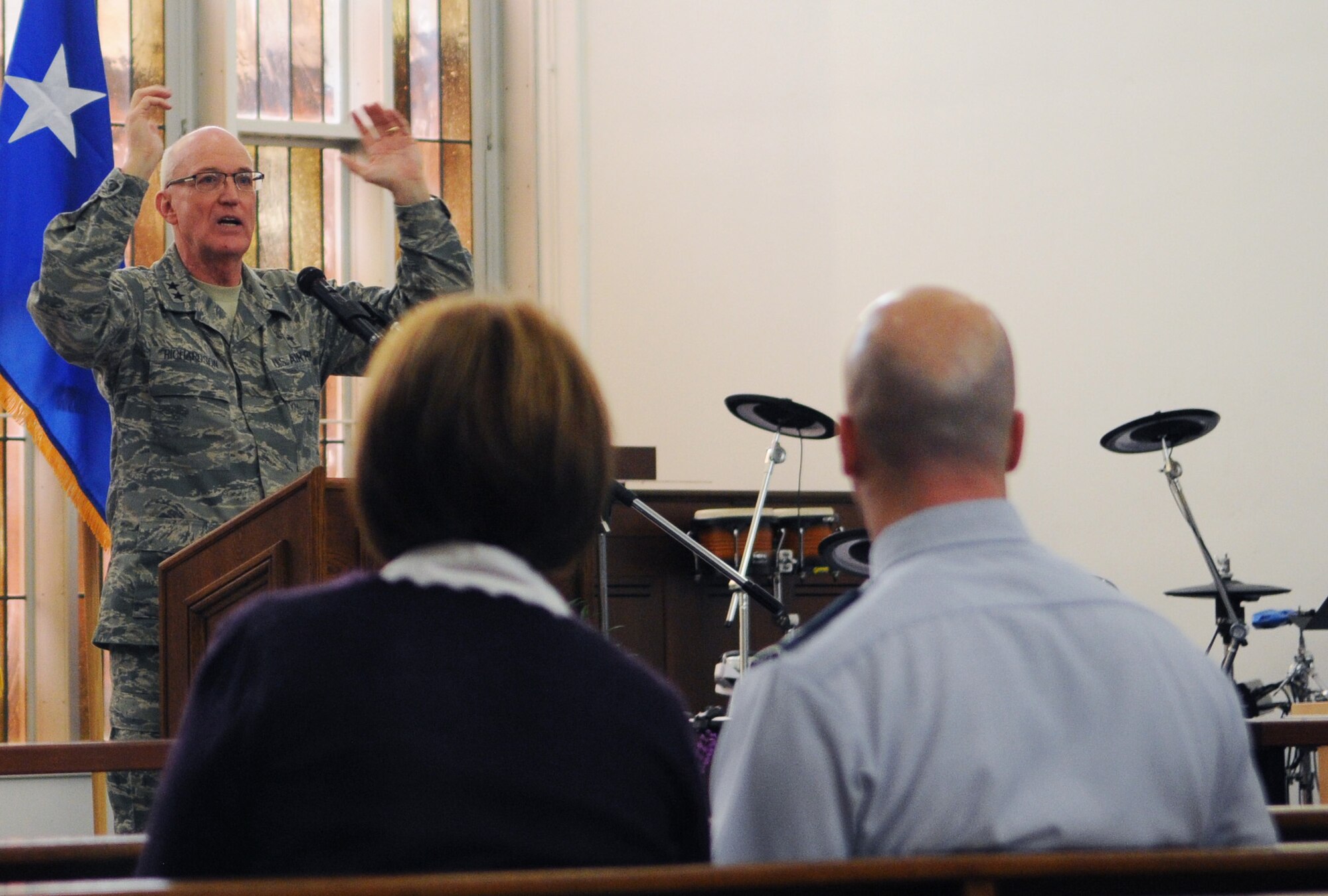 RAF MILDENHALL, England -- Col. Chad Manske, 100th Air Refueling Wing commander, and his wife, Stacey, listen to the sermon of Chap. (Maj. Gen.) Cecil Richardson, Air Force chief of chaplains, during the National Prayer Luncheon Feb. 11, 2011, at the base chapel. Chaplain Richardson said the goal of the event is to remind Airmen that just because they joined the military, they have not forfeited their right to practice their religion. (U.S. Air Force photo/Staff Sgt. Thomas Trower)