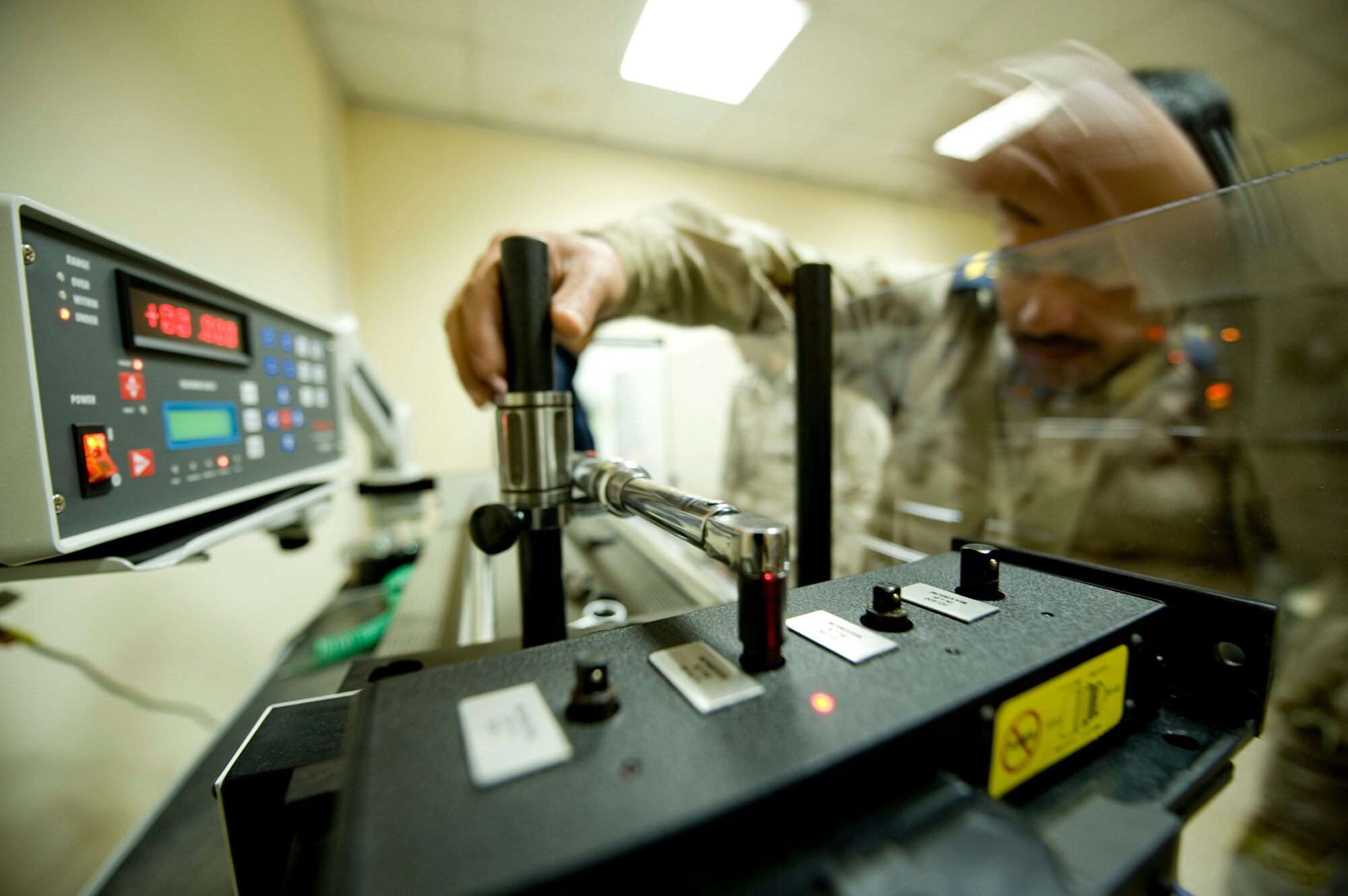 BAGHDAD -- Iraqi airmen train on a torque wrench calibration system at New Al-Muthana Air Base, Feb. 2. U.S Airmen taught Iraqi airmen how to calibrate their own torque wrenches, eliminating the need to send the tools to the U.S. for this process. (U.S. Air Force photo by Staff Sgt. Levi Riendeau)
