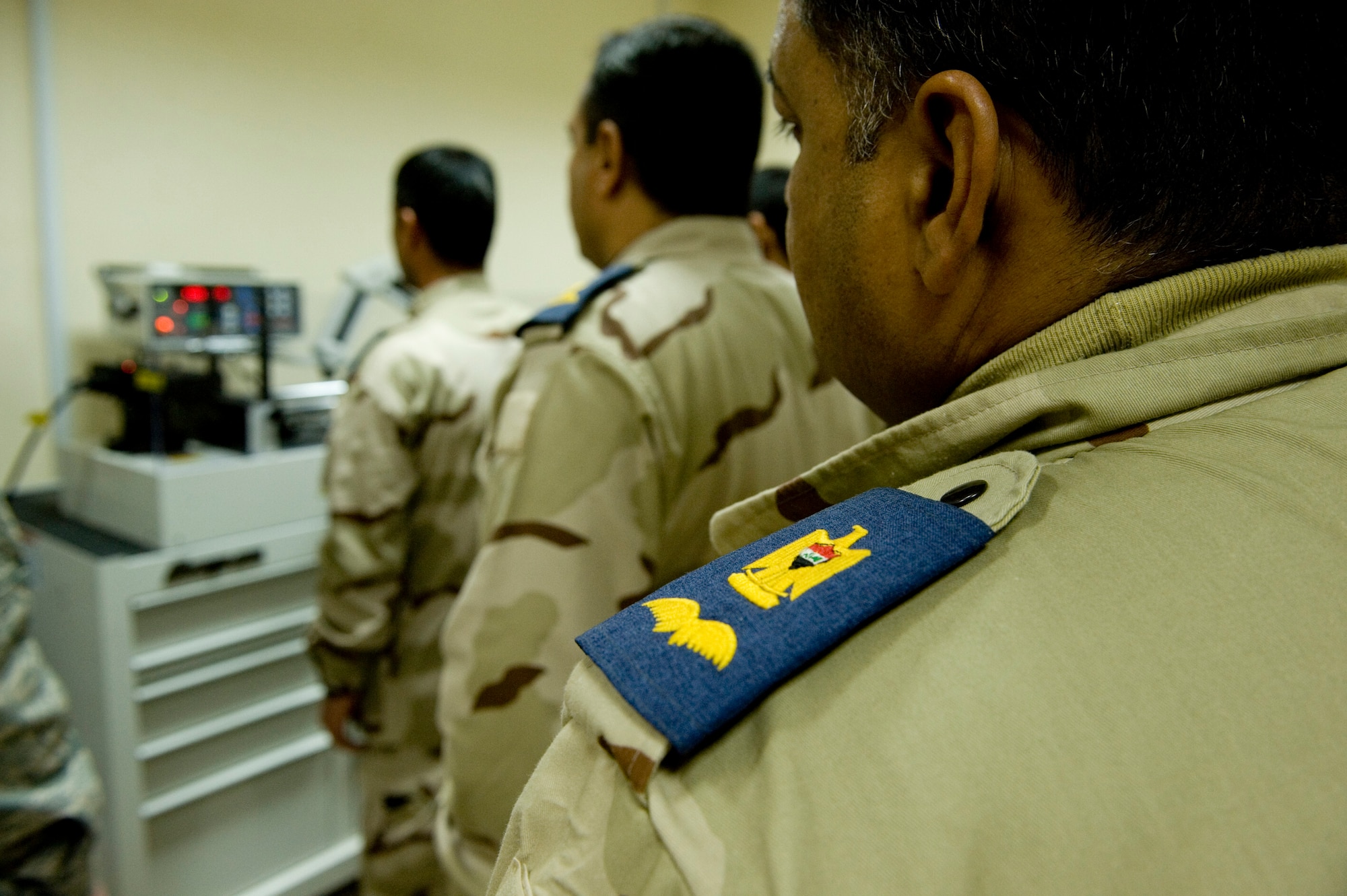 BAGHDAD -- Iraqi airmen train on a torque wrench calibration system at New Al-Muthana Air Base, Feb. 2. U.S Airmen taught Iraqi airmen how to calibrate their own torque wrenches, eliminating the need to send the tools to the U.S. for this process. (U.S. Air Force photo by Staff Sgt. Levi Riendeau)
