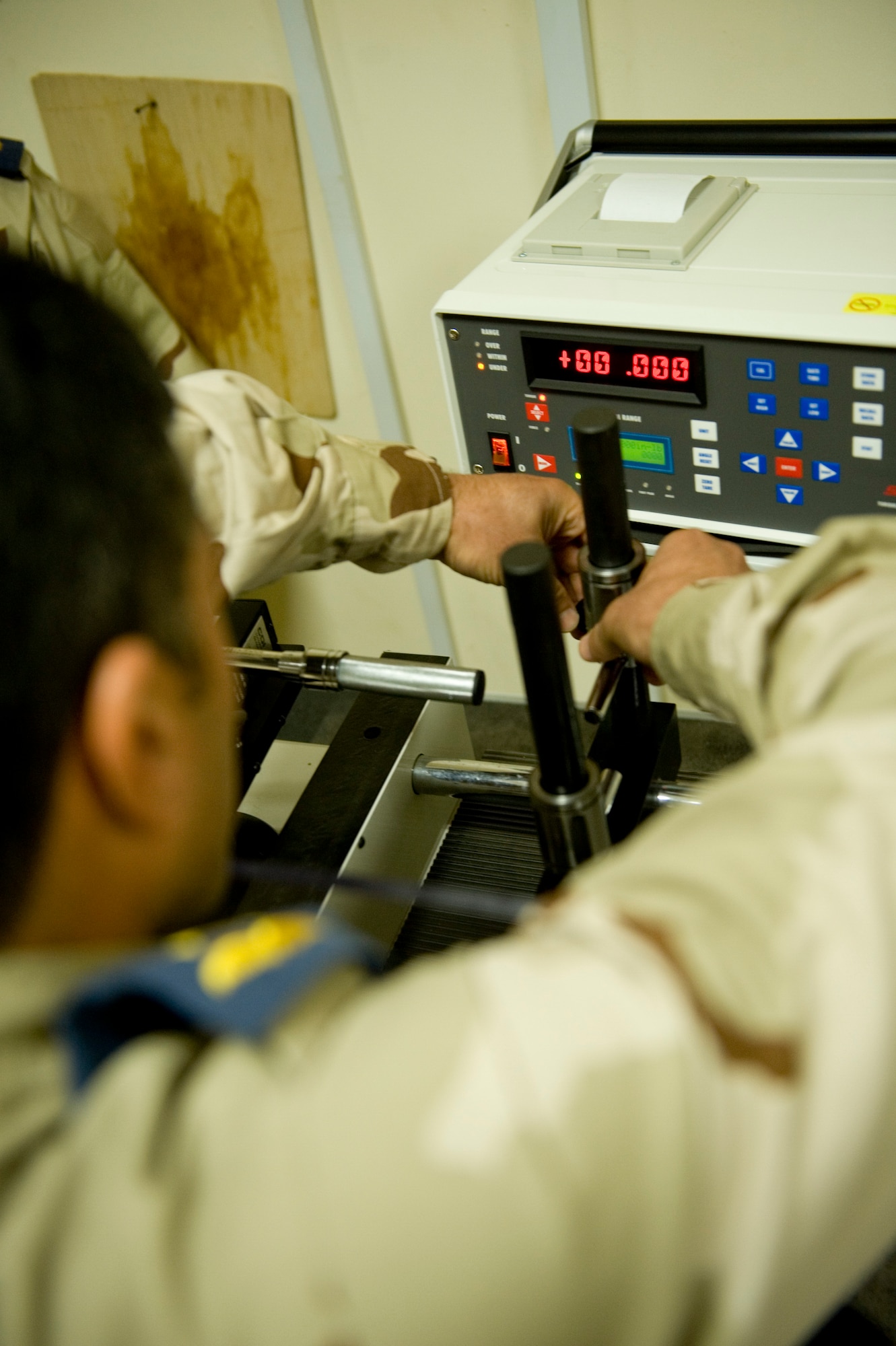 BAGHDAD -- Iraqi airmen train on a torque wrench calibration system at New Al-Muthana Air Base, Feb. 2. U.S Airmen taught Iraqi airmen how to calibrate their own torque wrenches, eliminating the need to send the tools to the U.S. for this process. (U.S. Air Force photo by Staff Sgt. Levi Riendeau)