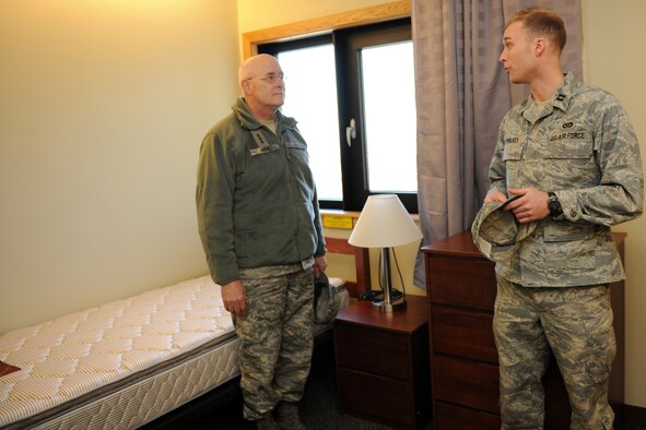 KUNSAN AIR BASE, Republic of Korea -- Lt. Gen. Loren Reno, Deputy Chief of Staff for Logistics, Installations and Mission Support, Headquarters U.S. Air Force, listens to Capt. Jeffrey Fowlkes, 8th Civil Engineering Squadron, explain the features of the newest base dormitories during a visit Feb. 11. In addition to touring the new dormitories, General Reno also dined with base Airmen and visited Big Coyote and various other facilities throughout the base. (U.S. Air Force photo/Tech. Sgt. Jonathan Pomeroy) 