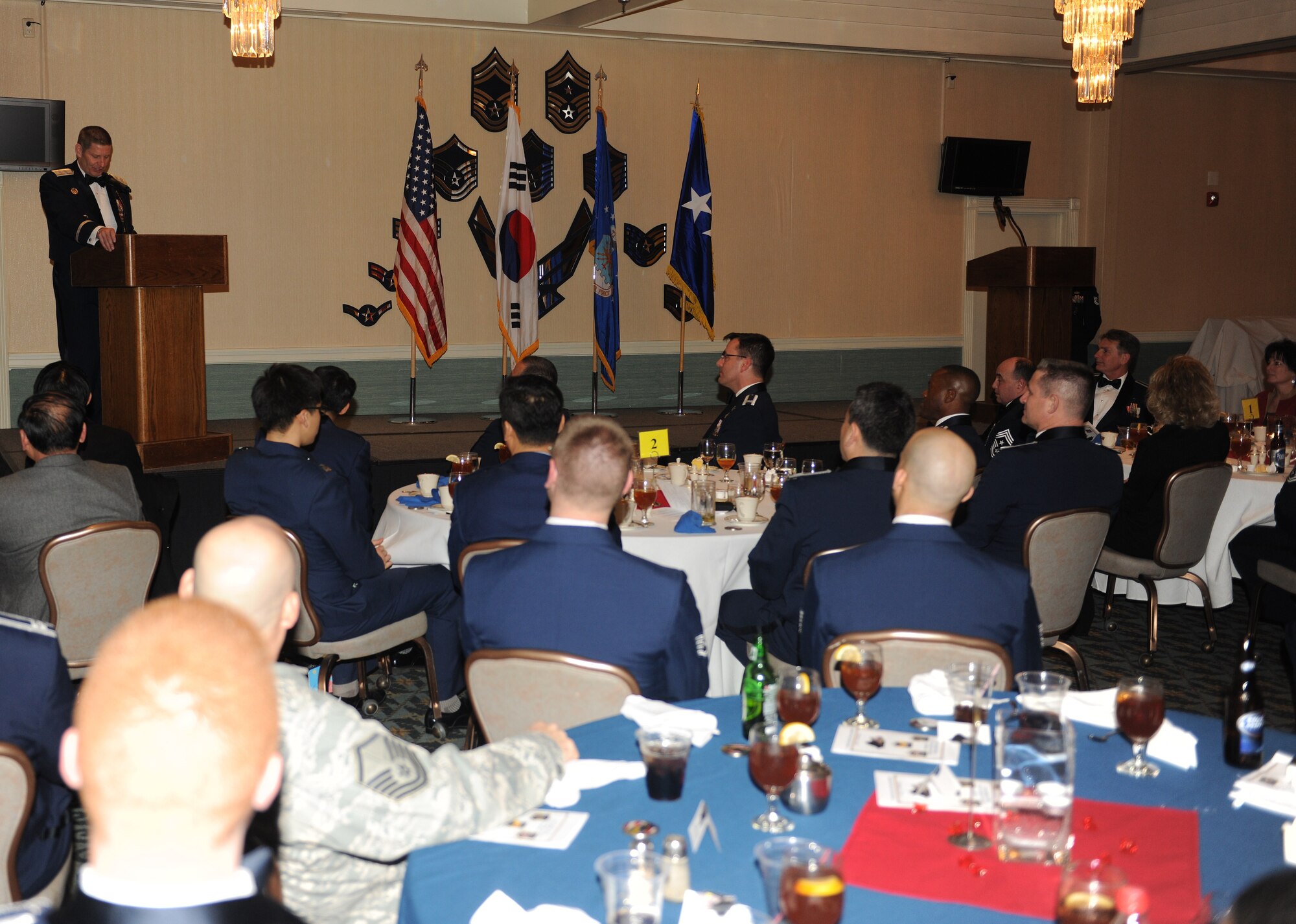 KUNSAN AIR BASE, Republic of Korea -- Maj. Gen. Robin Rand, Special Assistant to the Vice Chief of Staff, speaks to Wolf Pack Airmen about professionalism, commitment to excellence and service during the annual awards banquet here Feb. 11. General Rand was the Wolf Pack’s 42nd commander. (U.S. Air Force photo/Senior Airman Ciara Wymbs) 