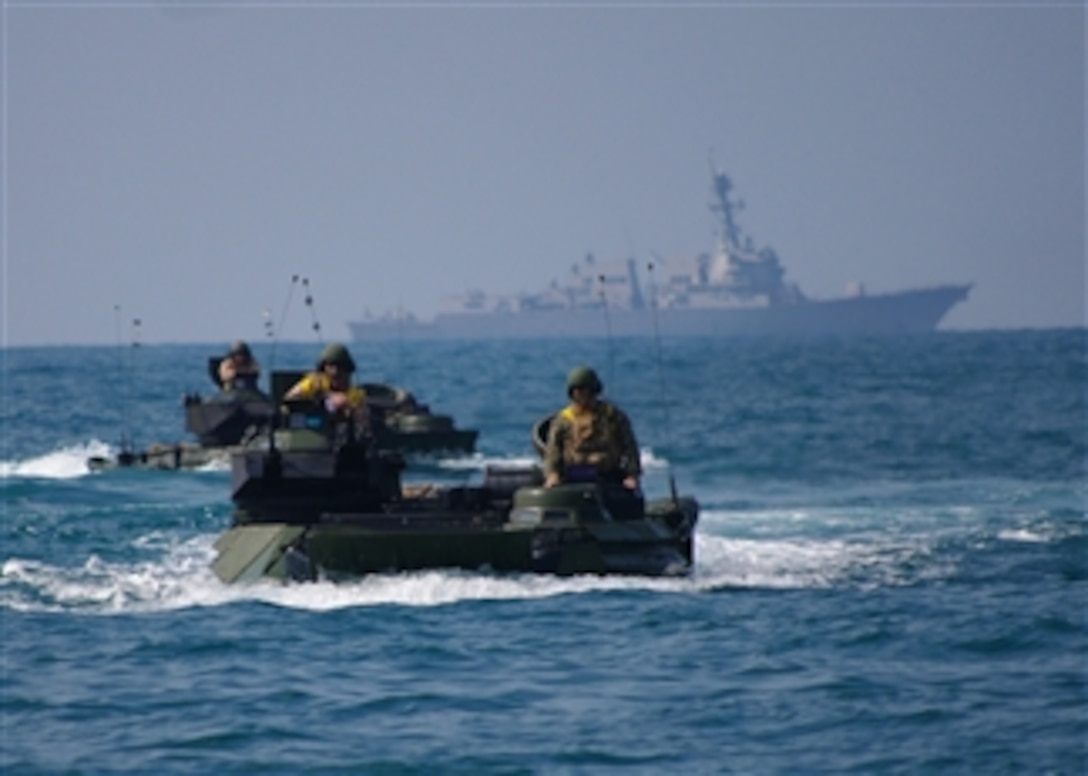 Amphibious assault vehicles from the amphibious transport dock ship USS Denver (LPD 9) participate in an amphibious exercise in the South China Sea on Feb. 10, 2011.  The Denver is part of the forward-deployed Essex Amphibious Ready Group and is underway participating in Cobra Gold 2011, a multinational military exercise designed to promote regional peace and stability.  