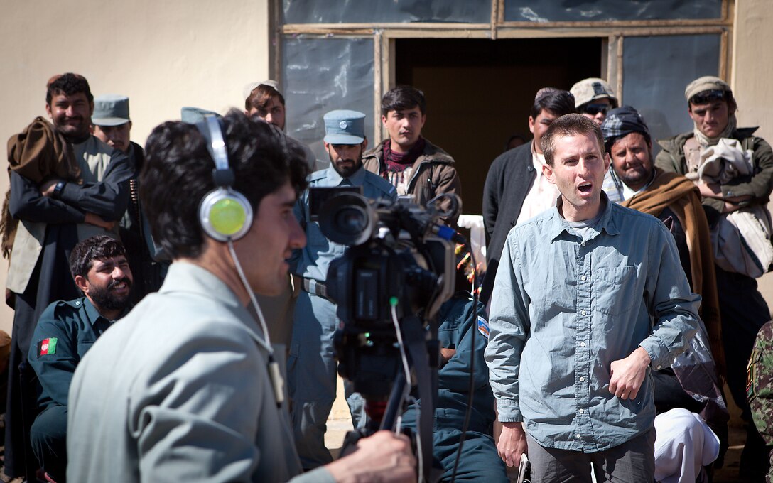 Carter Malkasian, the Department of State representative for Garmsir District, Helmand province, Afghanistan, addresses approximately 300 locals who attended the ribbon cutting of the Laki Girls School, in Garmsir district, Helmand province, Afghanistan, Feb. 15.