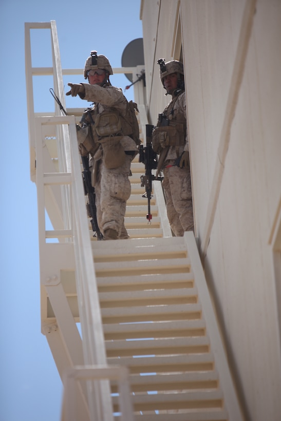 Marines with  1st Battalion, 5th Marine Regiment get a vantage point over the streets of the Combat Center’s new combined arms, live-fire, Military Operations on Urban Terrain training range here, as part of Enhanced Mojave Viper, Feb. 15, 2011.